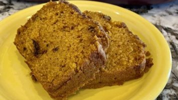 Two slices of pumpkin bread sliced on a plate