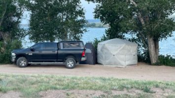 Truck and tent parked at Curt Gowdy State Park