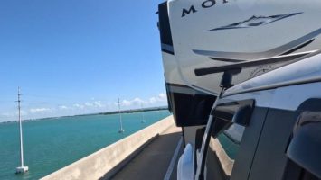 Picture of the Florida Keys with ocean and a view of a fifth wheel RV